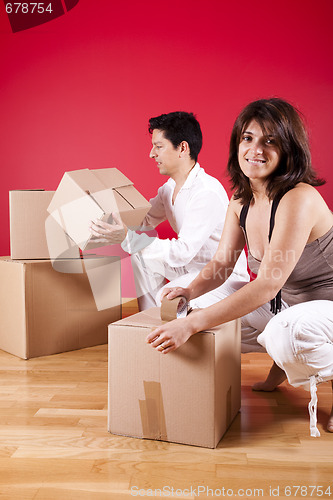 Image of young couple packing 