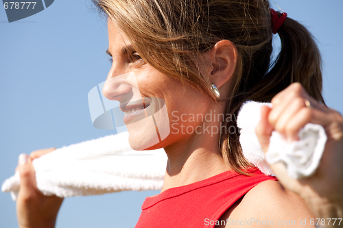 Image of sport woman with a towel