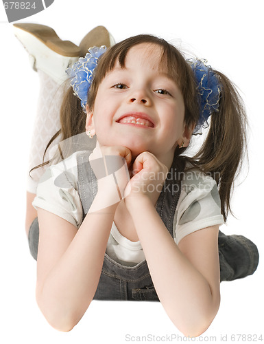 Image of smiling girl lie on  floor