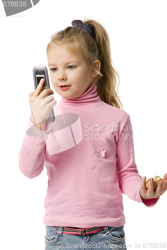 Image of little girl talks by mobile phone