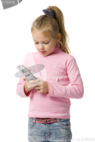 Image of little girl talks by mobile phone