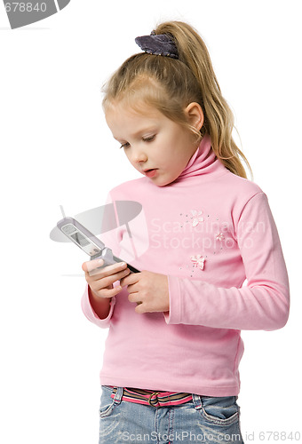 Image of little girl talks by mobile phone