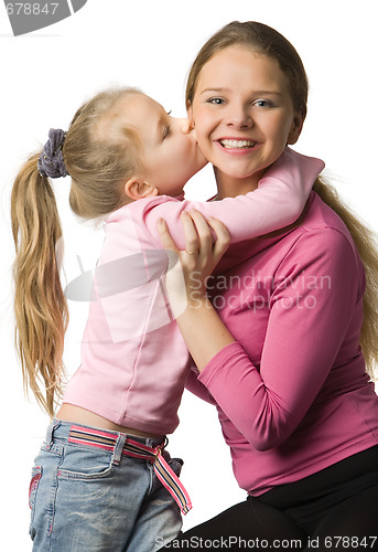 Image of Daughter kisses a mother