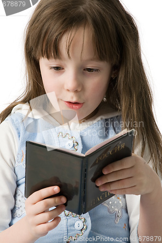 Image of Portrait of little girl with a passport in hands