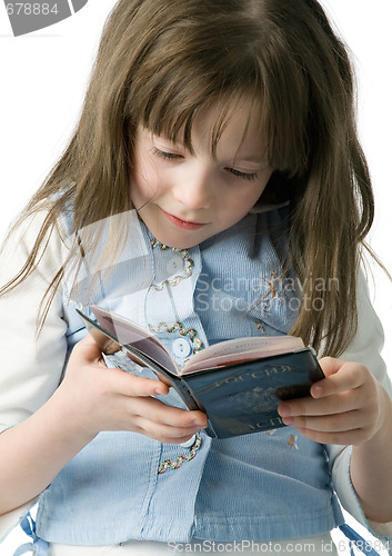 Image of Portrait of little girl with a passport in hands