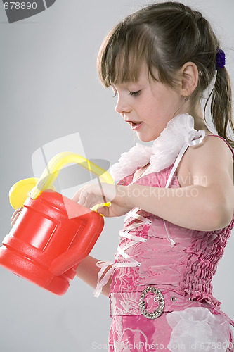 Image of Girl with a toy watering can