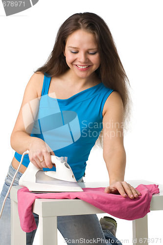 Image of happy woman with iron