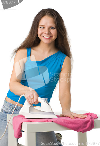Image of happy woman with iron