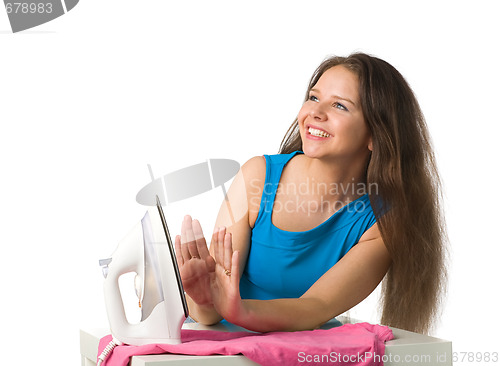 Image of happy woman with iron