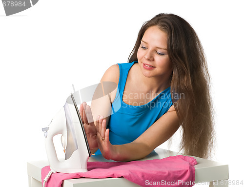 Image of happy woman with iron