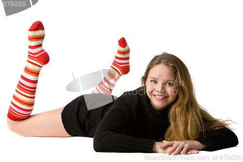 Image of smiling girl lies on the floor