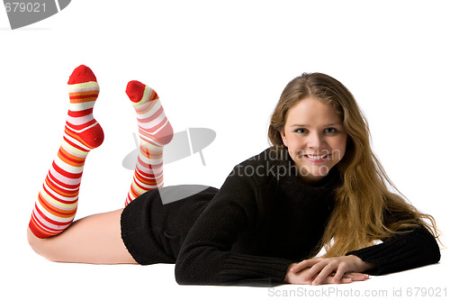 Image of smiling girl lies on the floor