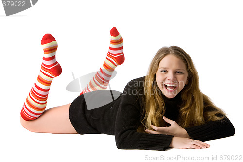 Image of smiling girl lies on the floor