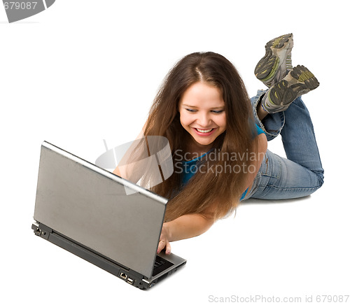 Image of girl with laptop lying on floor