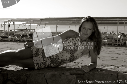 Image of Girl  lying on the sea side