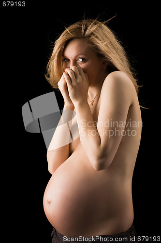 Image of bared pregnant woman