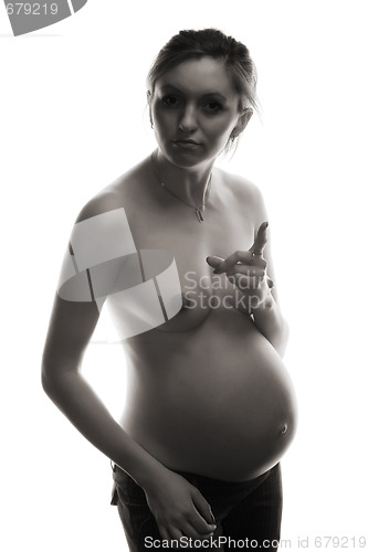 Image of bared pregnant woman