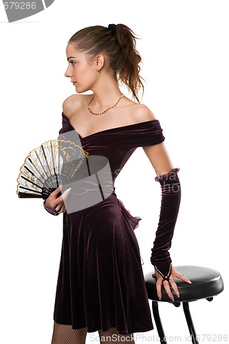 Image of Girl in dress with a fan