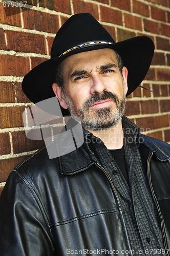 Image of Bearded man in cowboy hat