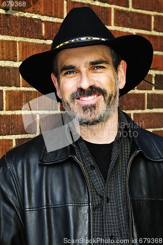 Image of Bearded man in cowboy hat