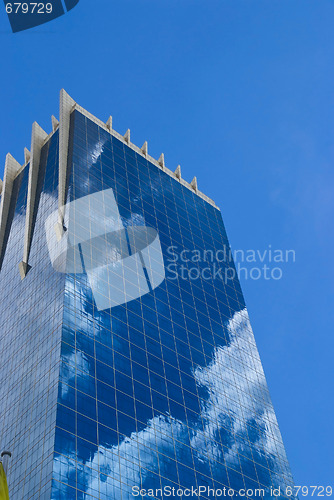 Image of Office building with reflection of clouds