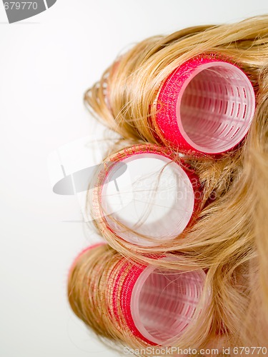 Image of Red Curlers in Blond Hair