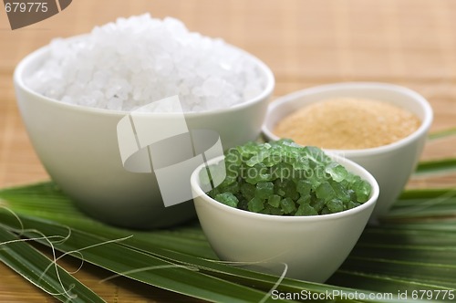 Image of bath salt and palm leaf