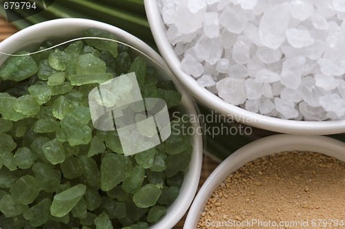 Image of bath salt and palm leaf