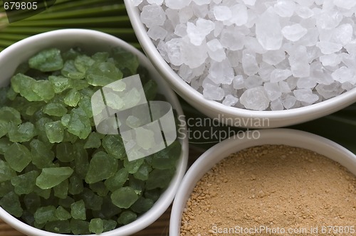 Image of bath salt and palm leaf