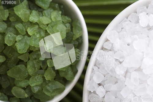 Image of bath salt and palm leaf