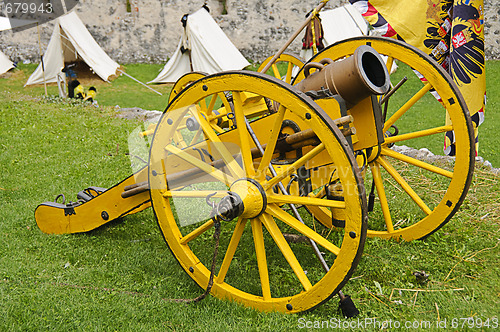 Image of Yellow cannon and flag