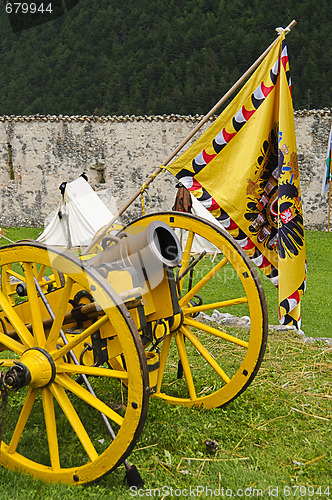 Image of Yellow cannon and flag