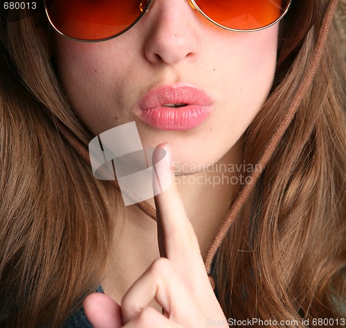Image of finger near lips