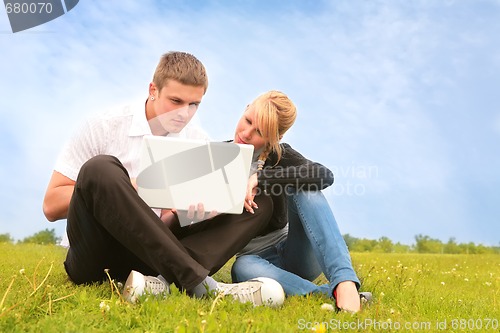 Image of young people and computer