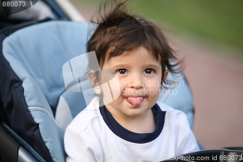 Image of adorable  naughty kid, soft focus