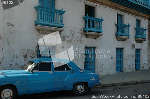 Image of old building and car