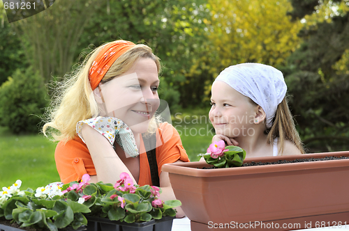 Image of Mother and daughter having gardening time