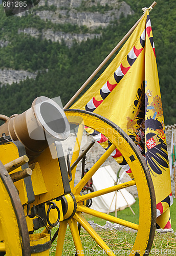 Image of Yellow cannon and flag