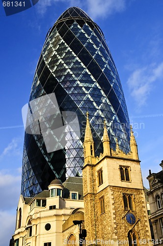 Image of Gherkin building and church of St. Andrew Undershaft in London