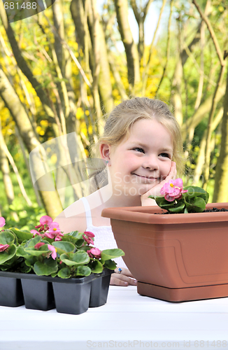 Image of Little girl - gardening