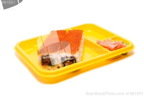 Image of Yellow plate with rolls of sushi