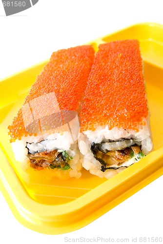 Image of Rolls of sushi at yellow table 