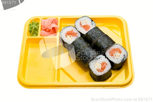 Image of Yellow plate with rolls of sushi