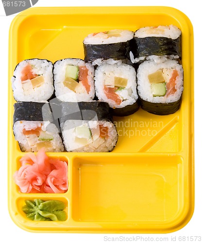 Image of Yellow plate with rolls of sushi