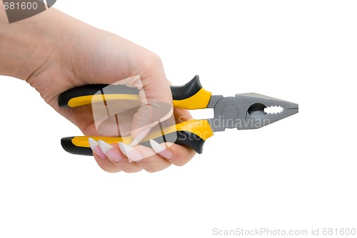 Image of Female hand hold black and yellow pliers