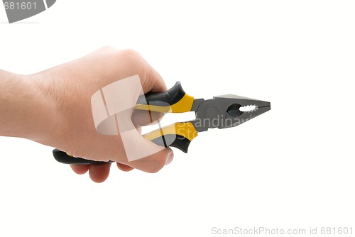 Image of Male hand with black and yellow pliers