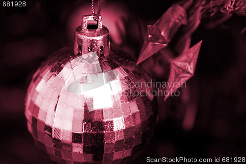 Image of Christmas ornaments on tree.