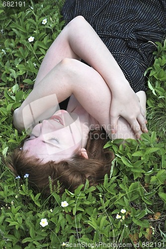 Image of  the young woman on the glade