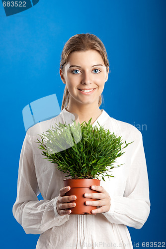 Image of Woman with a Plant