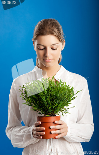 Image of Woman with a Plant